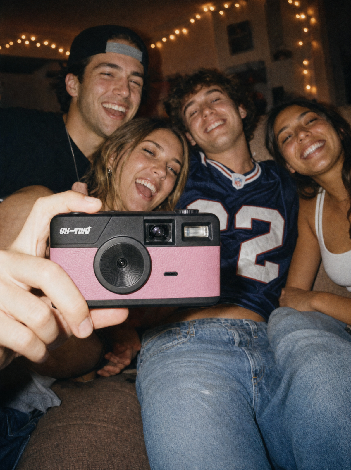 Friends at a party shot on the OH—TWO Digital Film Camera in Pink